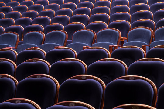 Blue chairs in the auditorium of the theatre or cinema