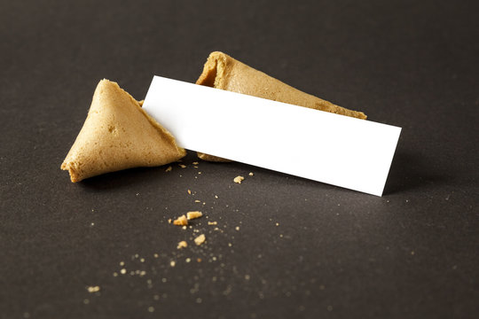 a fortune cookie with a blank paper for your message