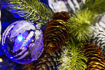 Naklejka na ściany i meble Christmas decorations on artificial fir.