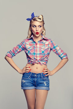  young surprised woman, dressed in pin-up style