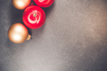 bright colors Christmas decorations on a dark slate surface