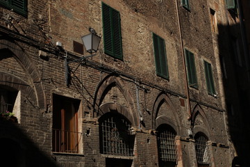 Cottage hidden in the shadows of the old town, Florence, Italy.