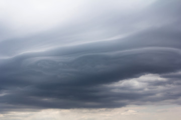 Asperatus-undulatus dark clouds over the lake