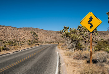 Winding road sign in Joshua Tree National Park, California