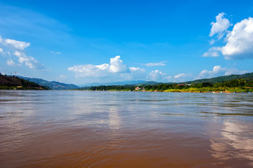 Panoramic view of Mekong river flowing between Laos on right side and Thailand at left side. Travel landscape and destinations