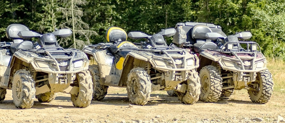 ATV in mud after riding through the woods.