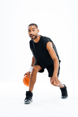 Portrait of a serious african sports man playing in basketball