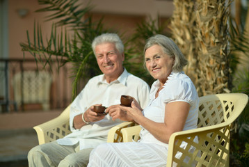  senior couple sitting with coffee