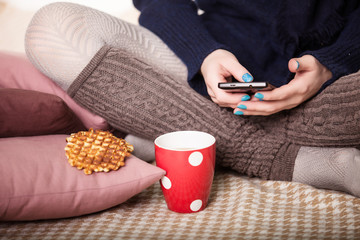 Person At Breakfast Looking At To Do List On Mobile Phone