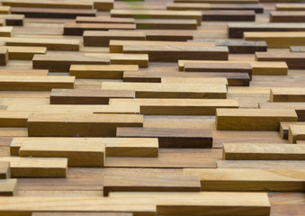 exposed wooden wall exterior, patchwork of raw wood forming a beautiful parquet wood pattern.(selected focus)