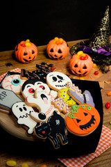 Creepy Halloween cookies and pumpkin baskets filled with candies