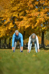 Obraz premium fit senior couple exercising