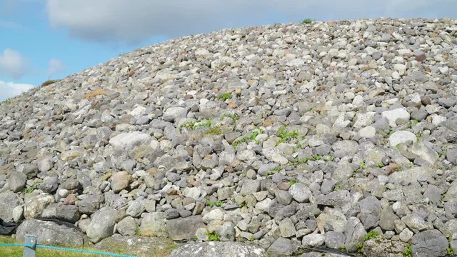 Lots of stones in an area in Carrowmore Megalithic Cemetery. It is like a mountain made in lots of stones
