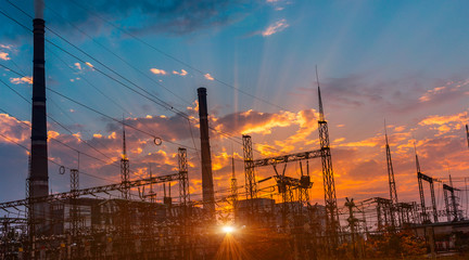 silhouette of coal electric power plant on the background of a beautiful sunset.