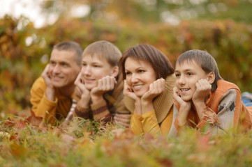 Happy family in autumn forest