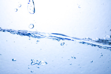 Closeup water wave and air bubbles in water.