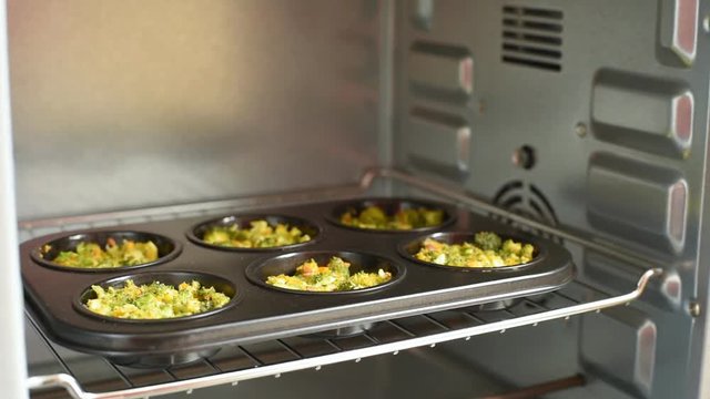 Hot tasty muffins with broccoli for dinner. Cooking concept