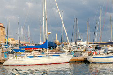 Fototapeta na wymiar Chania. Fishing boats and yachts in the harbor.