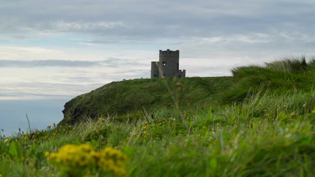 The OBriens Tower in Moher Ireland. OBriens Tower marks the highest point of the Cliffs of Moher in County Clare Ireland located a short distance from the village Doolin 