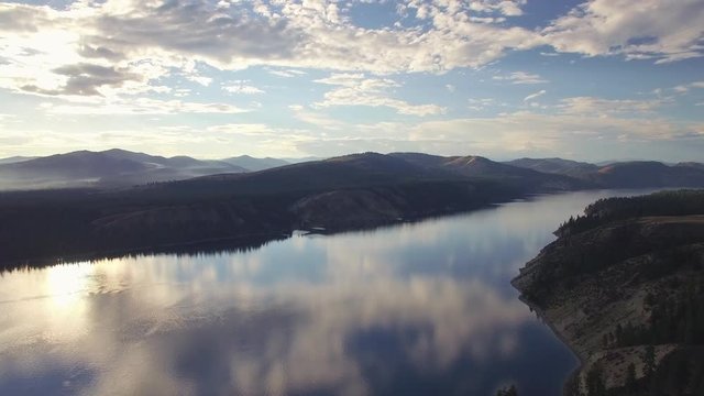 Drone Shot of Cloud Reflection on Massive Lake in Mountain Range