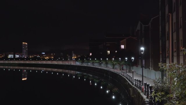 The night view in the baywalk side in Belfast Ireland with the street lamps in the city at night