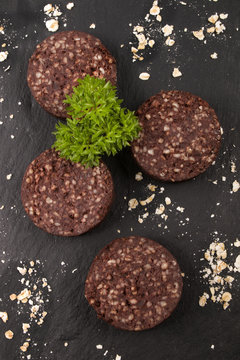 raw black pudding with oatmeal and parsley