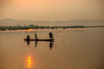 Fototapeta na wymiar Silhouette Two fishermen