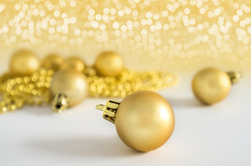 Golden Christmas balls background decoration lights snow winter