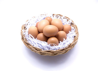 Brown eggs in basket with recycle paper 