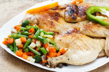 Chicken fried with vegetables on a napkin of burlap