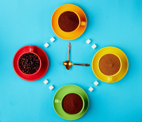 clock made with cups with coffee beans , ground coffee, capuccino , instant coffeand of coffee and...