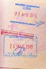 Opened passport with Maldives visa stamps ..