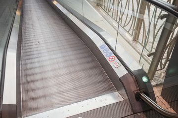 escalators stairway inside modern office building.