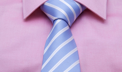 Blue necktie with white strip and pink shirt