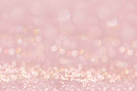 Bokeh Soft Pastel Pink Background With Blurred Golden Lights. Festive Background.