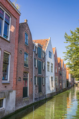 Fototapeta na wymiar Old warehouses along a canal in Alkmaar