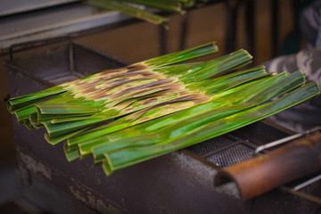 Thai dessert named "kanom jak"  wrapped in nipa palm leaves. © Quality Stock Arts