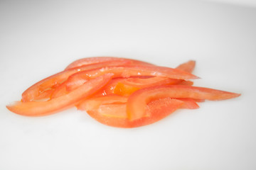 tomato slices on white background