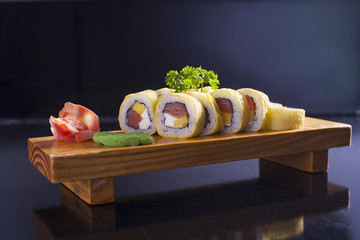 Set of red tuna, and mango sushi rolls.