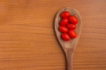 Cherry Tomatoes into a spoon