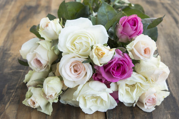 Bouquet of Roses on a Wooden Rustic Table