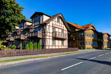 Traditional Lithuanian wooden and half-timber houses in the countryside. Juodkrante village, Lithuania.
