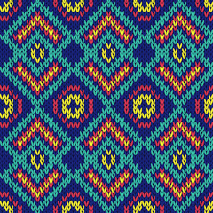 Fototapeta premium Ornate ethnic knitting motley seamless pattern mainly in blue hu