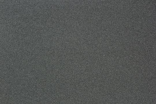 Gray monotone grain texture. Glitter sand background.