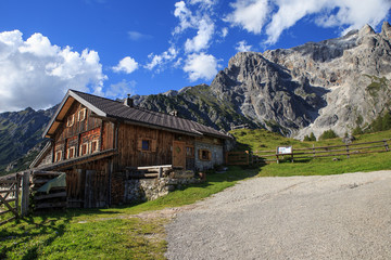 Fototapeta na wymiar Typical mountain huts in the Austrian Alps,on a sunny day with r