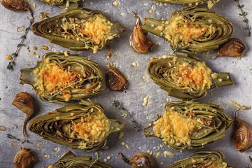 Tuinposter Artichokes baked with cheese, garlic and thyme. © tbralnina