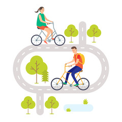 A young man and young woman ride bikes on the road. Cyclists. Cycling.