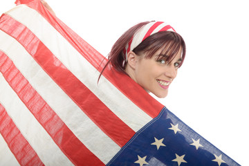 Fototapeta premium pretty young woman isolated holding an American Flag