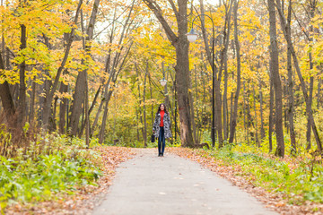 Fototapeta premium Pretty young student girl in autumn outdoor.