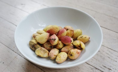 Freshly picked pistachio nuts in their outer shell